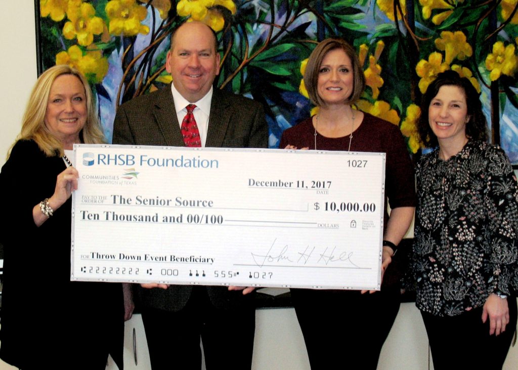 Karen Farris and John Hall present $10,000 check to The Senior Source